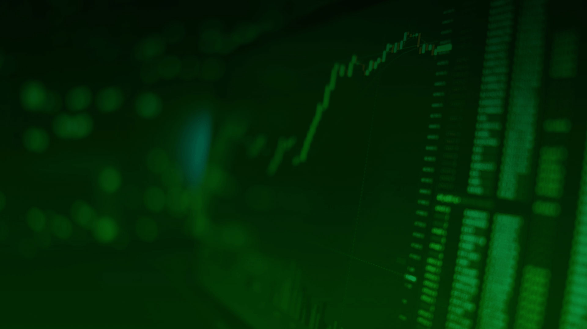 Green image of stock market data on screen
